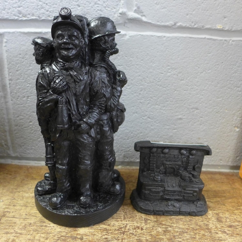 826 - Two coal figures; group of miners and a stove