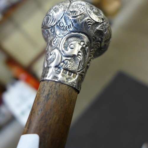 846 - A silver topped cane and a shooting stick