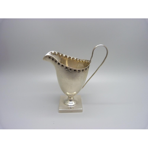 867 - A silver helmet shaped cream jug, Chester 1898, 61g