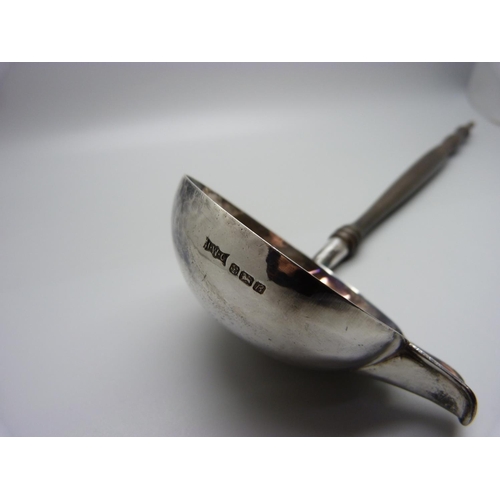 869 - A large silver punch ladle, Sheffield marks