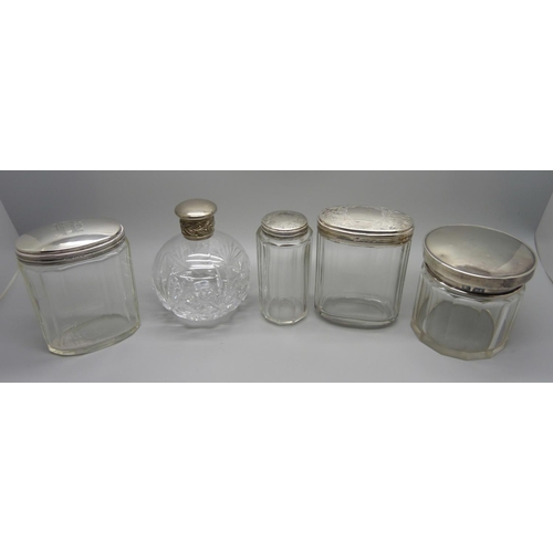 874 - Four vintage silver topped jars and a cut glass perfume bottle