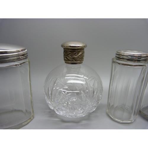 874 - Four vintage silver topped jars and a cut glass perfume bottle