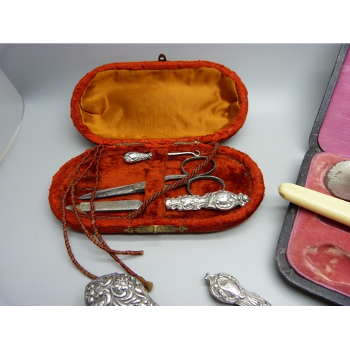 875 - A collection of silver handled manicures, shoe horn, etc.