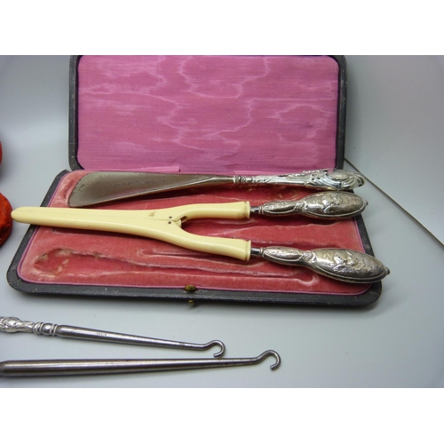 875 - A collection of silver handled manicures, shoe horn, etc.