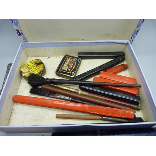 881 - A collection of gold leaf, a Swan gold nib pen, letter wax, gramophone needles, eye glass, etc.