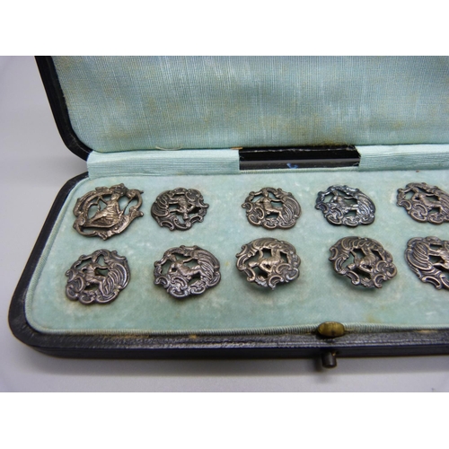 883 - A set of eleven silver buttons, Birmingham 1901, and one similar larger silver buttons, 23g