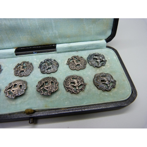 883 - A set of eleven silver buttons, Birmingham 1901, and one similar larger silver buttons, 23g