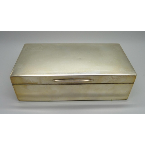 884 - A silver cigarette box with cedar lining, 528g gross