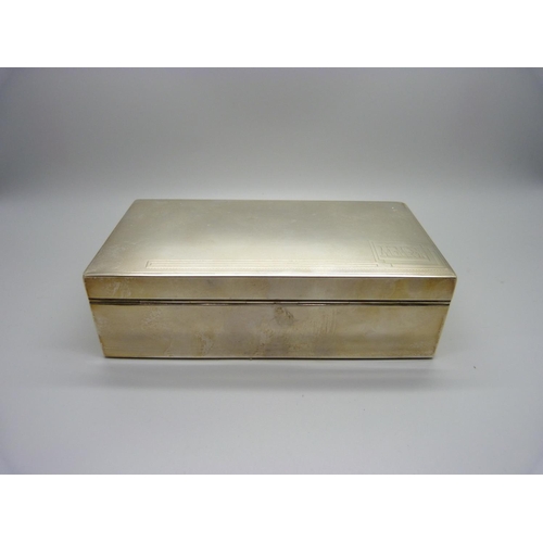 884 - A silver cigarette box with cedar lining, 528g gross