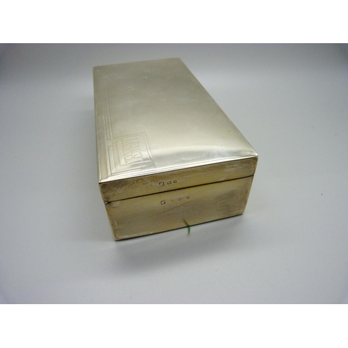 884 - A silver cigarette box with cedar lining, 528g gross