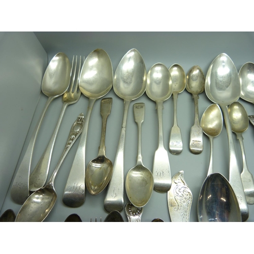 888 - A collection of silver flatware, 1302g