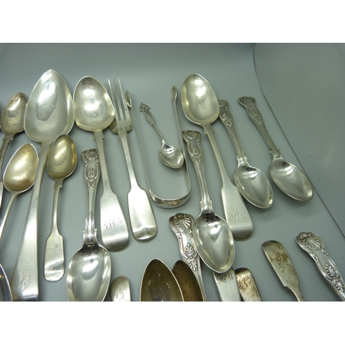 888 - A collection of silver flatware, 1302g