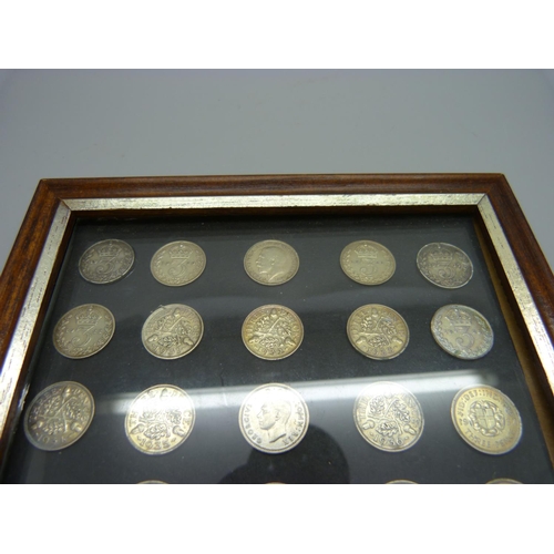 900 - A framed set of twenty silver threepence coins