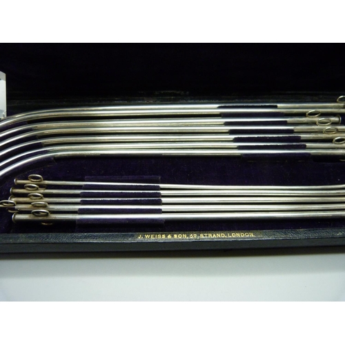 908 - A cased set of white metal medical/surgical instruments