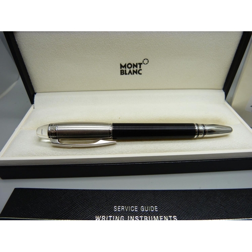 913 - A Mont Blanc Star Walker duo with 14ct gold nib, boxed and with warranty card dated 2007, spare ink ... 