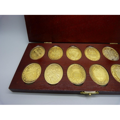 914 - Twelve medallions, The Arms of The Prince and Princess of Wales, boxed and hallmarked, 171g