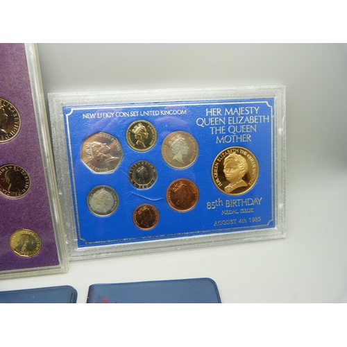 920 - A 1970 proof eight coin set, a 1985 85th Queen Mother eight coin set and two first decimal coin sets