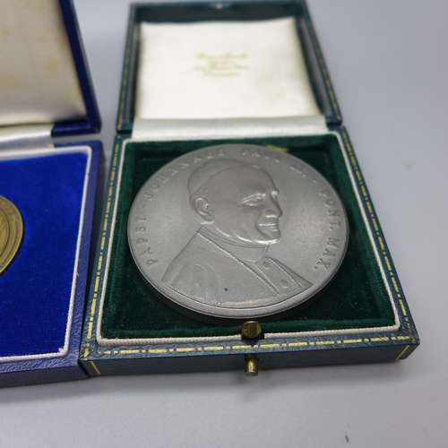 921 - A collection of medallions; four Australia and Pope John Paul II