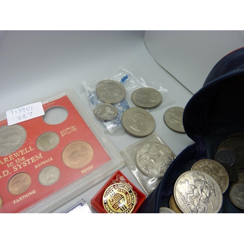 934 - A collection of British pre-decimal coins, crowns, a £5 coin and two badges