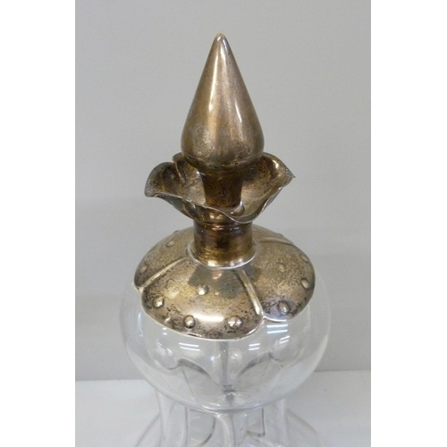 940 - A Victorian glug-glug decanter with silver top and stopper