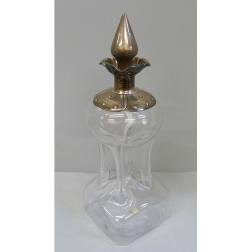 940 - A Victorian glug-glug decanter with silver top and stopper