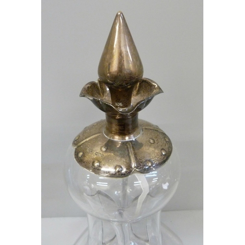 940 - A Victorian glug-glug decanter with silver top and stopper