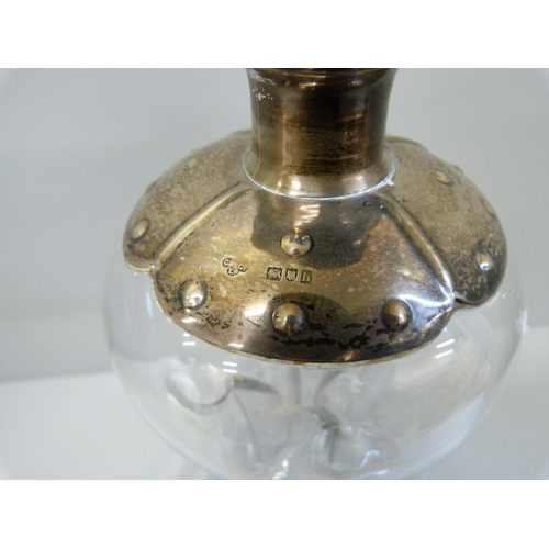 940 - A Victorian glug-glug decanter with silver top and stopper