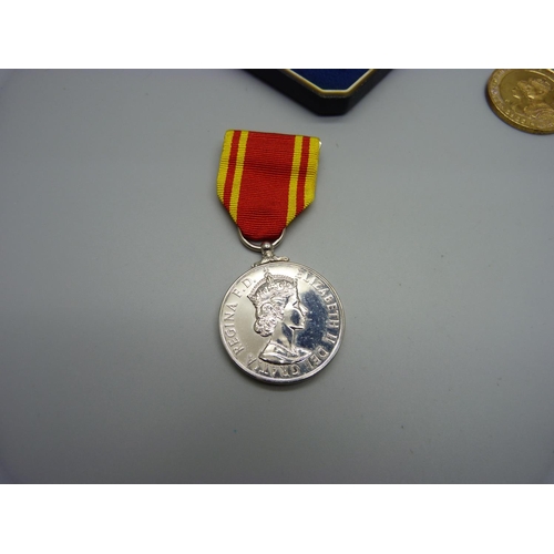 947 - A Queen Elizabeth II Fire Service medal, boxed and a local King Geoge VI Coronation medal