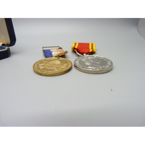 947 - A Queen Elizabeth II Fire Service medal, boxed and a local King Geoge VI Coronation medal