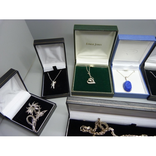 950 - Assorted boxed silver jewellery including a silver and stone set cross and chain, silver pendants an... 