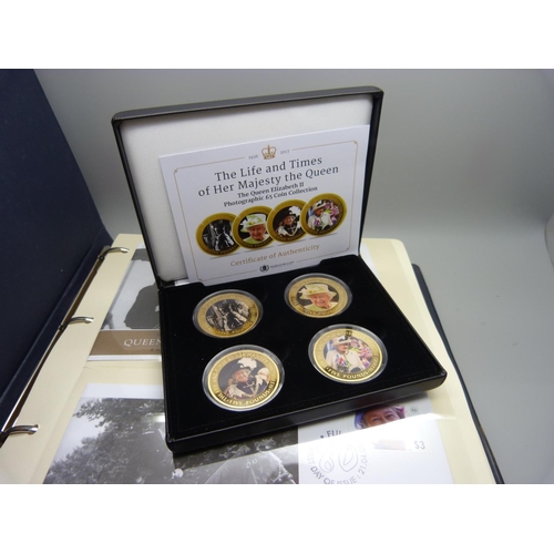 954 - An album of coin covers and a cased set of four The Queen Elizabeth II photographic £5 coin collecti... 