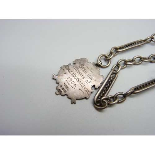 979 - A silver Albert chain and fob marked Star Inn, winners of Chase and District League 1904, 35g