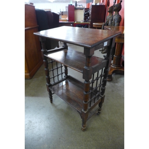 16 - A Liberty & Co. Arts and Crafts oak three tier bookstand, designed by Leonard Wyburd