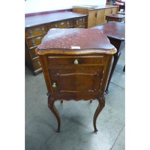 21 - A French mahogany and marble topped table de nuit