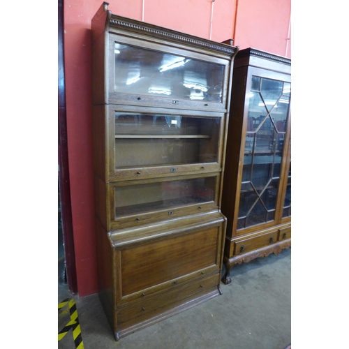 31 - An early 20th Century Lebus oak five tier sectional stacking bookcase, 198cms h, 88cms w, 44cms d