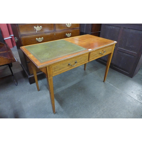 35 - An Edward VII inlaid mahogany and green leather topped writing table