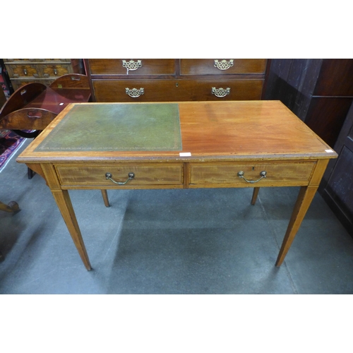 35 - An Edward VII inlaid mahogany and green leather topped writing table