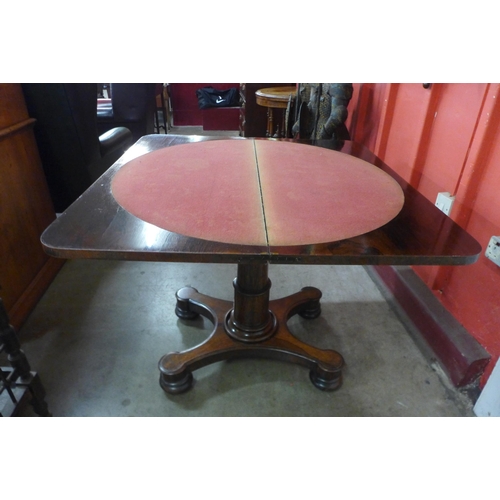 5 - An early Victorian carved rosewood rectangular fold-over games table