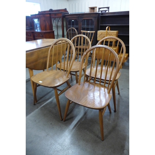 55 - A set of four Ercol Blonde elm and beech Windsor chairs