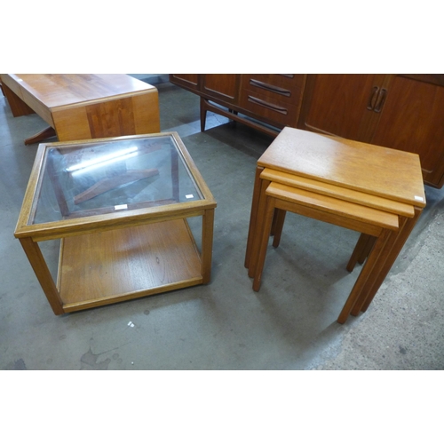 59 - A teak nest of tables and a teak and glass topped coffee table