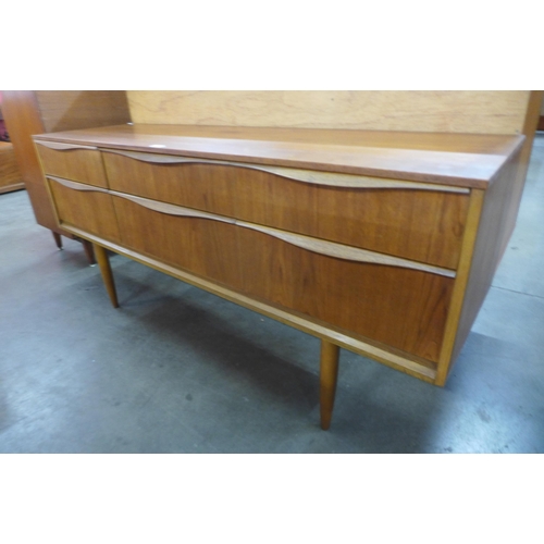 60 - An Austin Suite teak six drawer sideboard