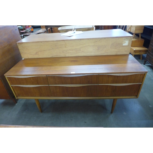 60 - An Austin Suite teak six drawer sideboard