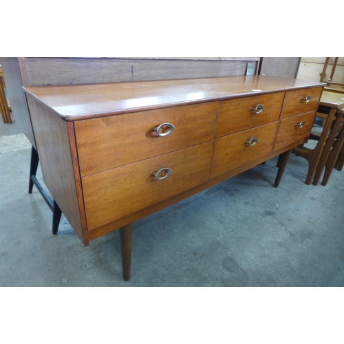 63 - A teak six drawer sideboard