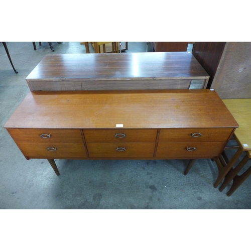 63 - A teak six drawer sideboard