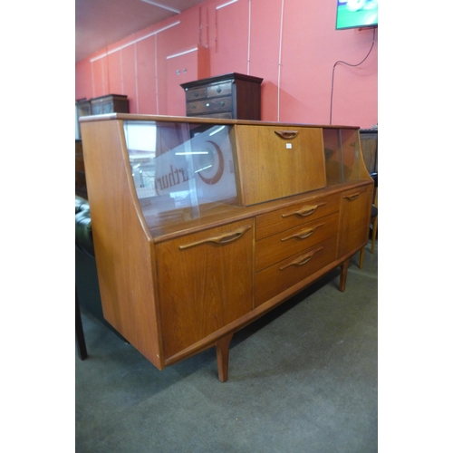 64 - A Jentique teak highboard