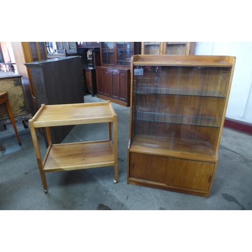 70A - A teak trolley and a teak bookcase