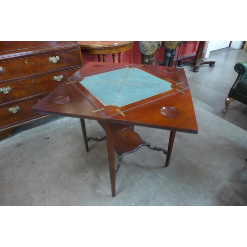 9 - An Edward VII inlaid mahogany envelope games table