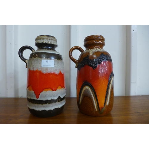 99 - A pair of similar West German Scheurich Keramik fat lava glazed pottery jugs, comprising of two 413-... 