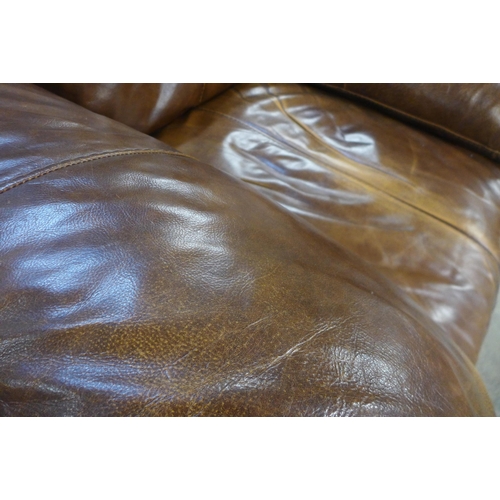 1622 - A brown leather three seater sofa and armchair