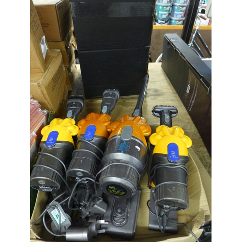 2108 - 4 Hand held Dyson vacuum cleaners - all with chargers and cleaning heads